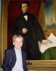Great, great, great grandson Rodolpe D'Arcy Quinn stands in front of an 1868 painting of Thomas D’Arcy McGee.