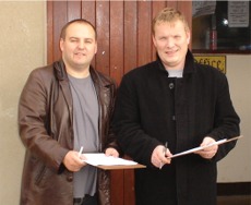 Sinn F�in Cllr P�draig MacLochlainn and local party candidate Sean Ruddy conduct their survey outside Carn Mart.
