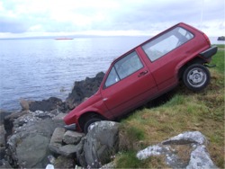 The abandoned car stuck on the rocks in Greencastle this week.