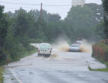 Vehicles battle through several feet of flooding at Poundtown on the Upper Road, Greencastle.