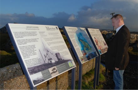 Sinn F�in candidate Sean Ruddy reads the information panels at Banba's Crown.