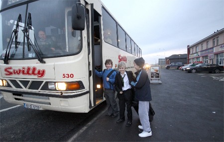 Derry pupils of Col�iste Chine�l Eoghain in Buncrana board a Swilly bus in Bridgend.